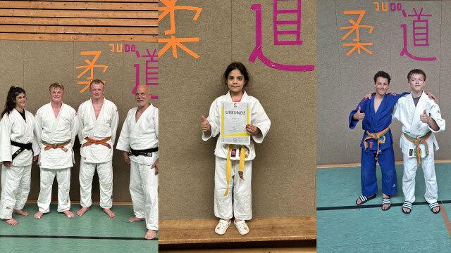 Gruppe von Judoka in verschiedenen Uniformen, ein Kind hält eine Urkunde, zwei Jungen posieren in blauen und weißen Anzügen.