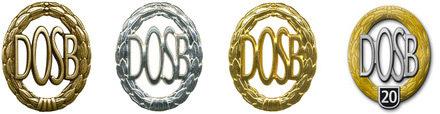 Vier Medaillen des Deutschen Olympischen Sportbundes (DOSB) in Gold, Silber, Bronze und eine Jubiläumsmedaille mit 20.